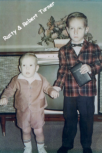 <rusty and robert turner holding a bible all dressed up for sunday school and church>